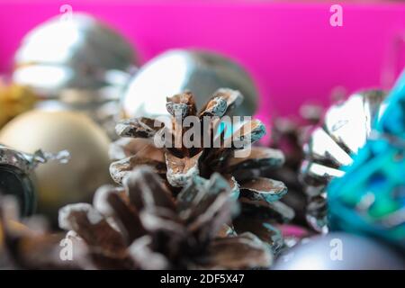 Christmas tree toys in the form of gold and silver balls, cones. New Year's festive background Stock Photo