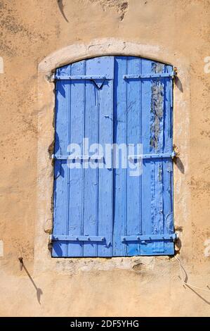 Closed shuttered window of French village house. Stock Photo