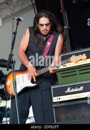 JoJo, bass guitar player for the Grammy Award winning Rock-N-Roll trio Los  Lonely Boys, grimaces as he plays during a music concert featuring the  Texas based band, at Contingency Operating Base Speicher