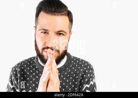Portrait of a man with a beard, cunning, thoughtful guy conceived something, isolated white background. Negative human emotions, facial expressions, Stock Photo