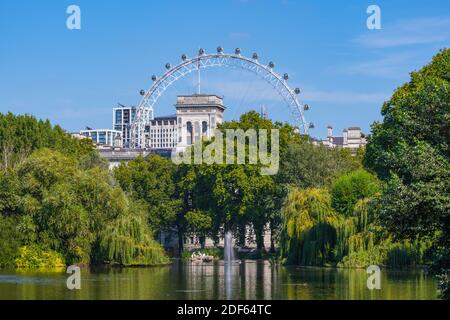 View of the Coca-Cola London Eye across the lake from St. James's Park, City of Westminster, City of London, England, UK. Stock Photo