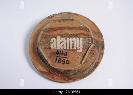 plate crockery, Anonymous, first quarter of the 16th century, lead glaze, earthenware, General: 5.5 x 25.5cm 55 x 255mm, Plate of red fired earthenware, covered with a yellowish lead glaze on the front. The plate has a round bottom that stands on three lobed legs and a spreading wall with a profiled mouth edge. The flat is almost completely covered with yellow silt, which has left the shard in a number of places. Written on the bottom 311c / 1890, 1890 Stock Photo