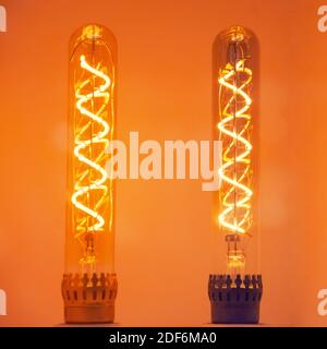 Two bulbs with a vintage glowing spiral of warm light Stock Photo