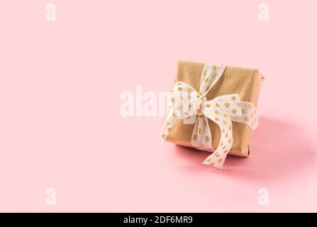 Gift or present box on pink pastel background.  Stock Photo