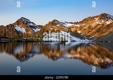 WA18645-00...WASHINGTON  - The Entiat Mountains reflecting in Lower Ice Lake in the early morning hours, part of the Glacier Peak Wilderness. Stock Photo