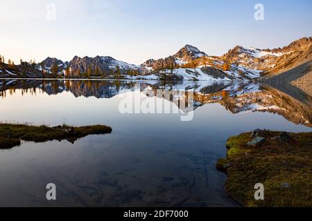 WA18647-00...WASHINGTON - The Entiat Mountains reflecting in Lower Ice Lake, in the Glacier Peak Wilderness. Stock Photo