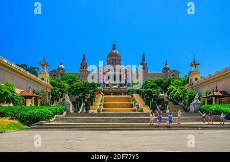 Barcelona, Spain, June 12, 2017: Palau Nacional or National Palace of Montju c and National Art Museum of Catalonia and walking tourists in historical Stock Photo