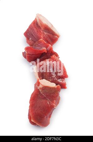 Studio shot of chunks of lamb cut out against a white background - John Gollop Stock Photo