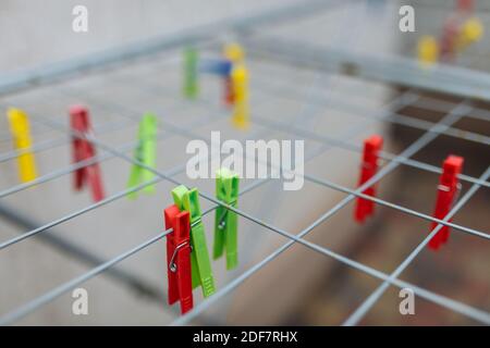 Multicolored: red, yellow, green, blue clothespins on the rack,background image ,text betting dryer and clothespins for linen Stock Photo