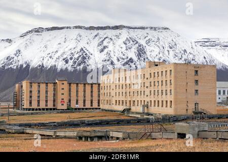 Hotel Tulpan and former apartment block, accommodation for miners at Pyramiden, abandoned Soviet coal mining settlement on Svalbard / Spitsbergen Stock Photo