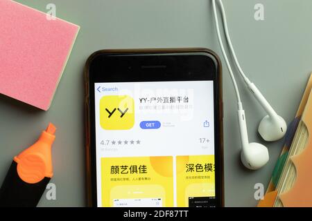 New York, USA - 1 December 2020: YY mobile app icon on phone screen top view, Illustrative Editorial. Stock Photo