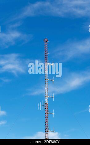 Aerial antennas on the metallic mast. Communication equipment on the mobile tower. Stock Photo