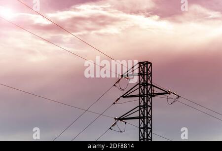 Energy distribution. Power transmission tower. High voltage three phase single circuit overhead electric line. Stock Photo