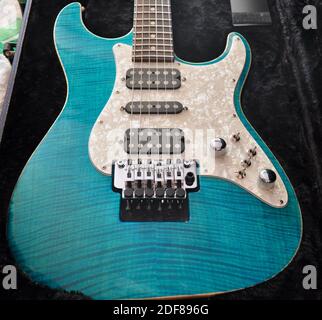 Drop Top Classic Bora Bora Blue electric guitar details on the tone knob and pickups located on the top. Stock Photo