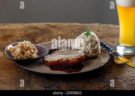 bavarian roasted pork on dark wood Stock Photo