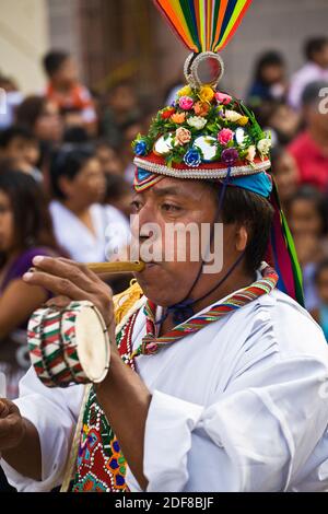 Dance troupes come from all parts of Mexico representing their tribe in the annual INDEPENDENCE DAY PARADE in September - SAN MIGUEL DE ALLENDE, MEXIC Stock Photo