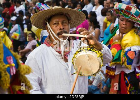 Dance troupes come from all parts of Mexico representing their tribe in the annual INDEPENDENCE DAY PARADE in September - SAN MIGUEL DE ALLENDE, MEXIC Stock Photo