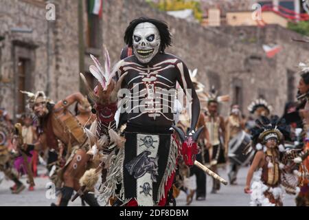 INDIGENOUS DANCE TROUPES from all over MEXICO parade through the streets in celebration of San Miguel Arcangel, the patron saint of SAN MIGUEL DE ALLE Stock Photo