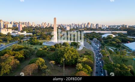 Aerial view of Sao Paulo city and obelisk monument, next to Ibirapuera Park. Prevervetion area with trees and green area of Ibirapuera park  in Sao Pa Stock Photo