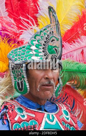 INDIGENOUS DANCE TROUPES from all over MEXICO parade through the streets in celebration of San Miguel Arcangel, the patron saint of SAN MIGUEL DE ALLE Stock Photo
