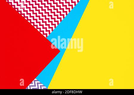 Abstract geometric fashion papers texture background in yellow, red, pink, blue colors. Top view, flat lay Stock Photo