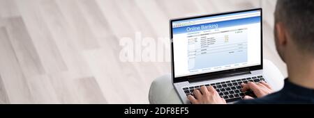 Man Using Online Bank To Pay Money Stock Photo