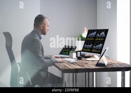 Analyst Broker Or Trader Working With Financial Data On Computer Stock Photo