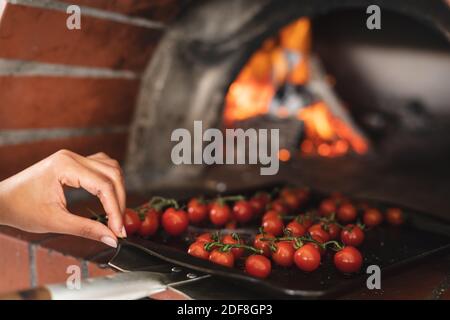 Mixed race female chef in kitchen Stock Photo