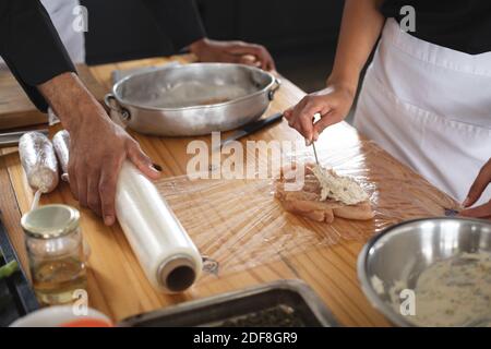 Divserse group of chefs in kitchen Stock Photo