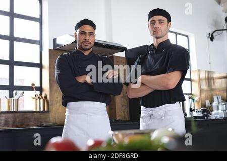 Two divserse male chefs in kitchen Stock Photo