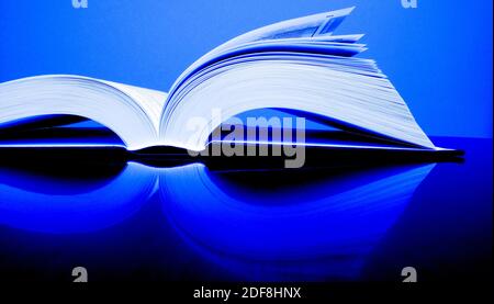 Books open on desk top table for reading or studying Stock Photo