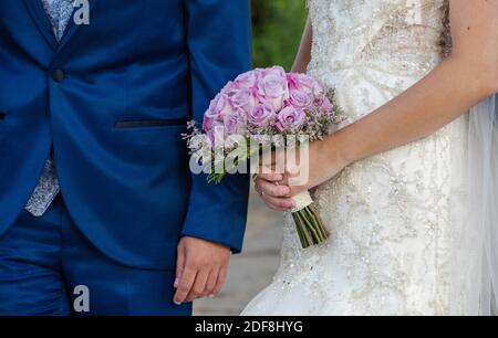 Wedding couple with a beautiful bouquet of bridal flowers for that special day, Gran Canaria. Spain. Stock Photo
