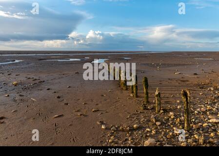 interesting autumnal skies with dark clouds and blue sky over snettisham on the norfolk coast Stock Photo