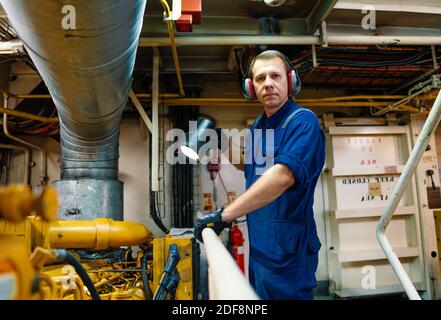 Marine engineer officer controlling vessel enginesand propulsion in ...