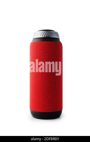 Portable bluetooth speaker standing isolated on white background. Red colored cylindrical shape. Stock Photo