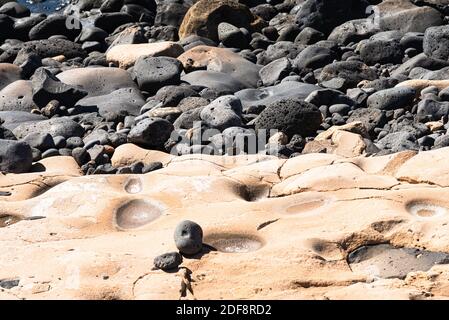 Volcanic rocks structure smooth lava stone background texture. Stock Photo