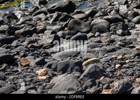 Volcanic rocks structure smooth lava stone background texture. Stock Photo