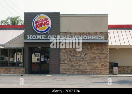 Burbank, CA / USA - Aug. 19, 2020: A Burger King location exterior is shown, with the restaurant chain’s logo and “HOME OF THE WHOPPER” sign visible. Stock Photo