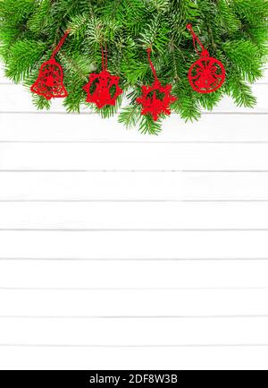 Christmas background with red decoration on white wood texture Stock Photo