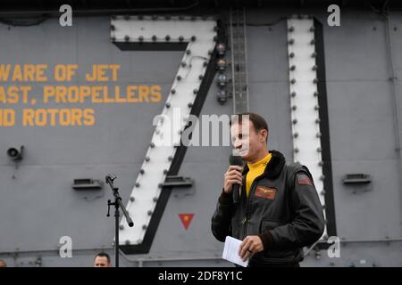 Hand out file photo dated November 14, 2019 of Capt. Brett Crozier, commanding officer of the aircraft carrier USS Theodore Roosevelt (CVN 71), addresses the crew during an all-hands call on the ship’s flight deck in the Paific Ocean. The US navy has dismissed the commander of the USS Theodore Roosevelt aircraft carrier, who had raised the alarm about an outbreak of coronavirus on his ship. Thomas Modly, the acting secretary of the navy, said that Captain Brett Crozier had been relieved of his command of the nuclear-powered carrier because he had copied in too many people on an internal memo o