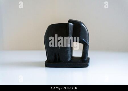 Black Marble Elephant side profile souvenir on white background from Mysore, South India Stock Photo
