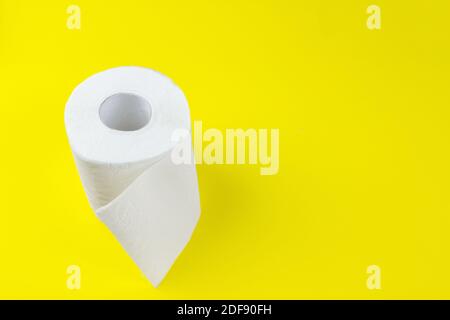 Top view of white toilet paper rolls on red background with copy space Stock Photo