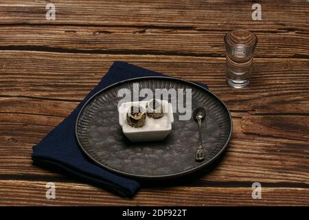 boiled quail eggs with caviar on a wooden table Stock Photo