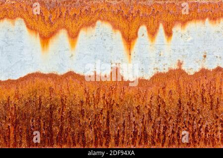 Orange rust patterns on a galvanised steel metal surface Stock Photo