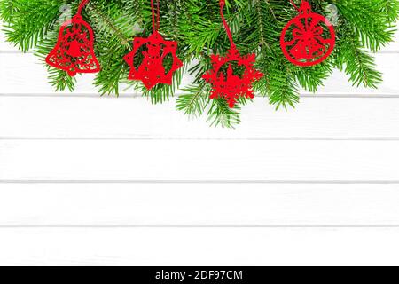 Red Christmas ornaments on white wood background Stock Photo
