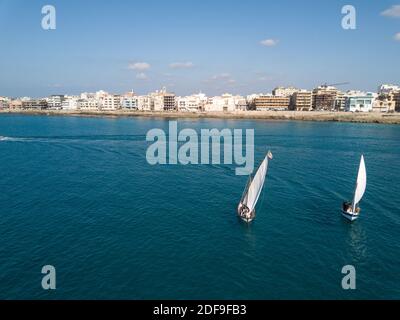 Puglia: latin sail boat sailing in Gallipoli bay view from air Stock Photo