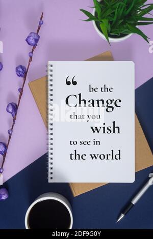 Motivational and inspirational wisdom quote. Notebook with pen on pastel purple and blue background. Stock Photo