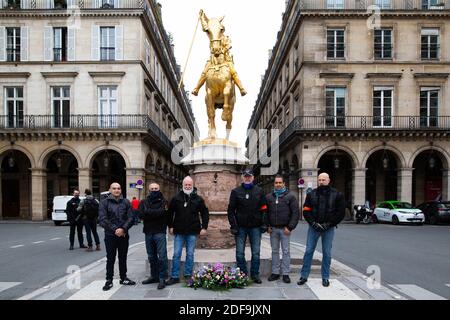 Members of the DPS Departement protection civile who handle the security of RN president Marine Le Pen pose for a photo in front of the Joan of Arc statue. Rassemblement