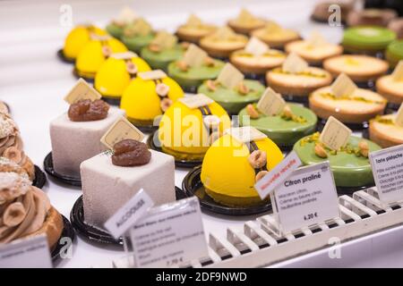 Delicious and beautiful rows of desserts pastries from a gourmet Asian chef in Paris, France. Sharp colorful close up. Stock Photo
