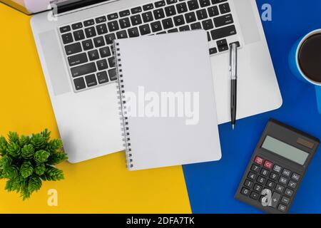 Notebook with copy space on laptop on top of office desk. Business concept. Stock Photo